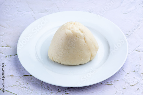 A close up plate of pounded yam or fufu