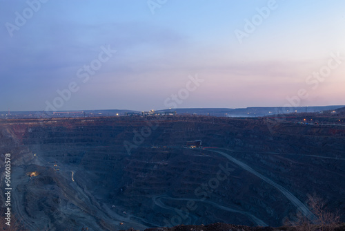 General view of the iron ore quarry. The round-the-clock mining process. Shooting in the evening or in the morning.