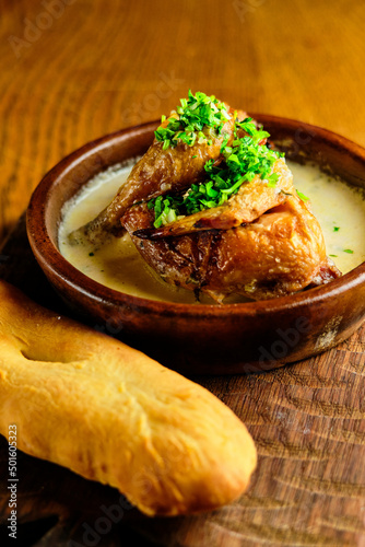 Butadon, Japanese rice bowl dish consisting of bowl of rice topped with pork belly simmered surved with with Japanese oden soup. photo