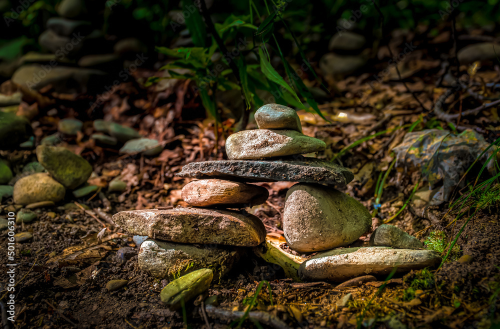 Setting Sun lights the Cairns stacked along the trail at Watkins Glen State Park in Upstate NY Setting Sun lights the Cairns stacked along the trail at Watkins Glen State Park in Upstate NY