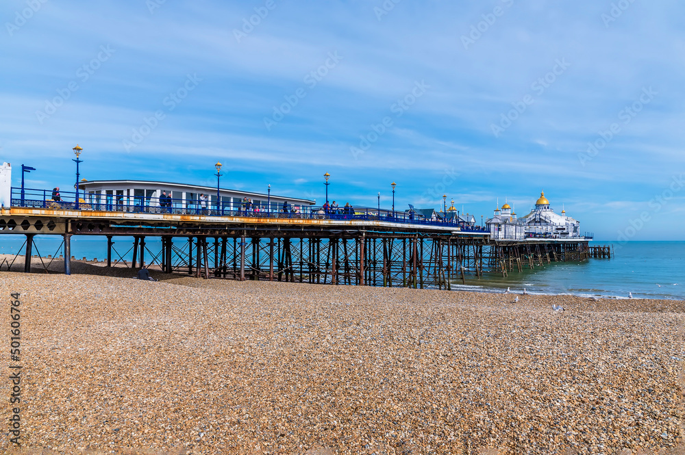 A view looking down the length of the pier at Eastbourne, UK in springtime