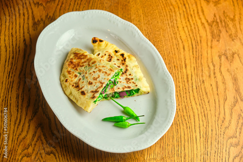 Flatbread stuffed with cheese and herbs. National Georgian dish