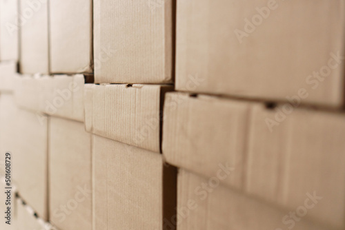 Set of cardboard brown boxes in storehouse. Background of carton boxes in wsrehouse