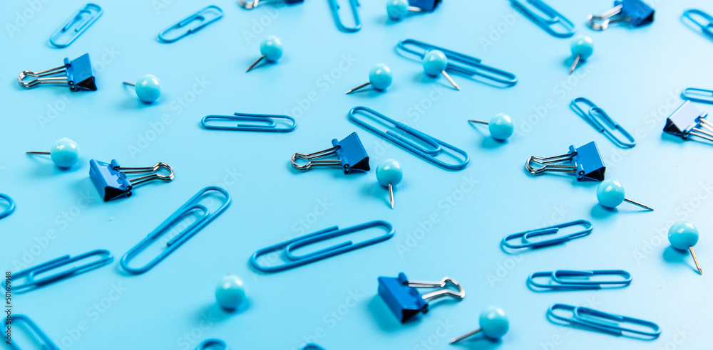 Paper clips on a blue background Paper clips on a blue background