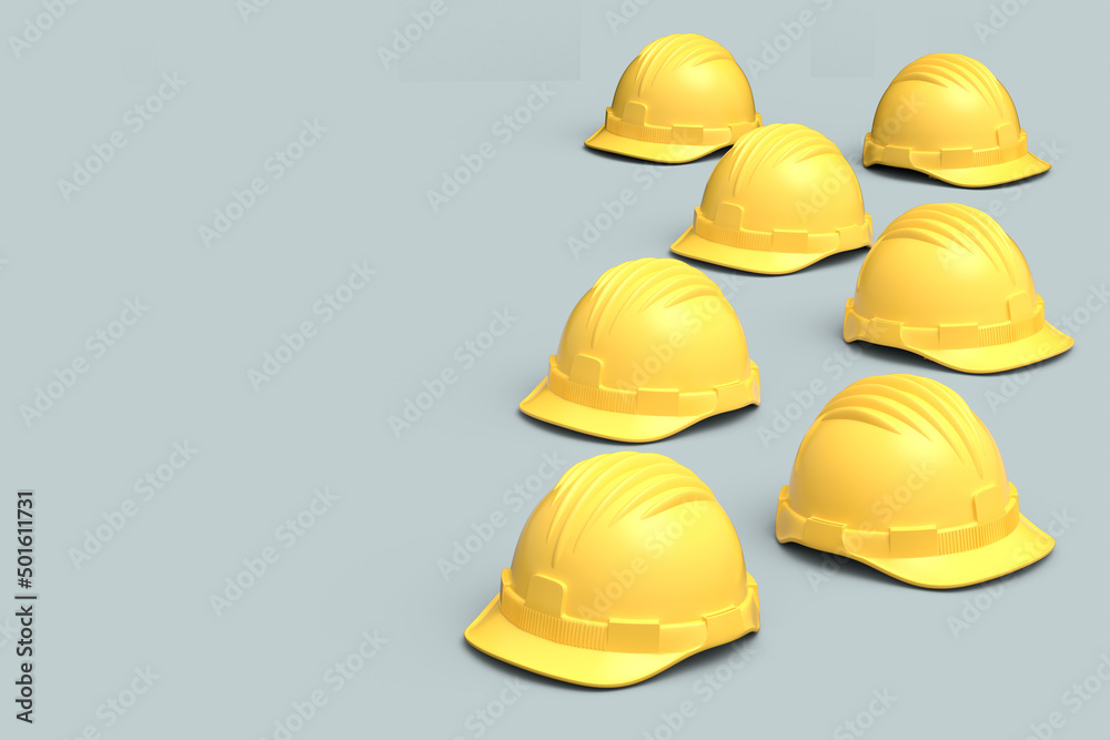 Set of yellow safety helmets or hard caps isolated on grey background Set of yellow safety helmets or hard caps isolated on grey background