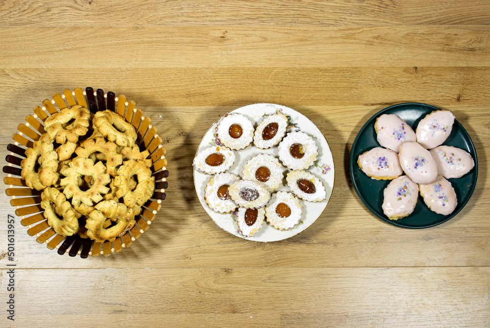 happy Eid Al fitr Concept, Oriental Algerian sweet cookies with apricot jam named in french sablé and kaak of tlemcen in arabic and other cookies named halwat tabaa or torno happy Eid Al fitr Concept, Oriental Algerian sweet cookies with apricot jam named in french sablé and kaak of tlemcen in arabic and other cookies named halwat tabaa or torno