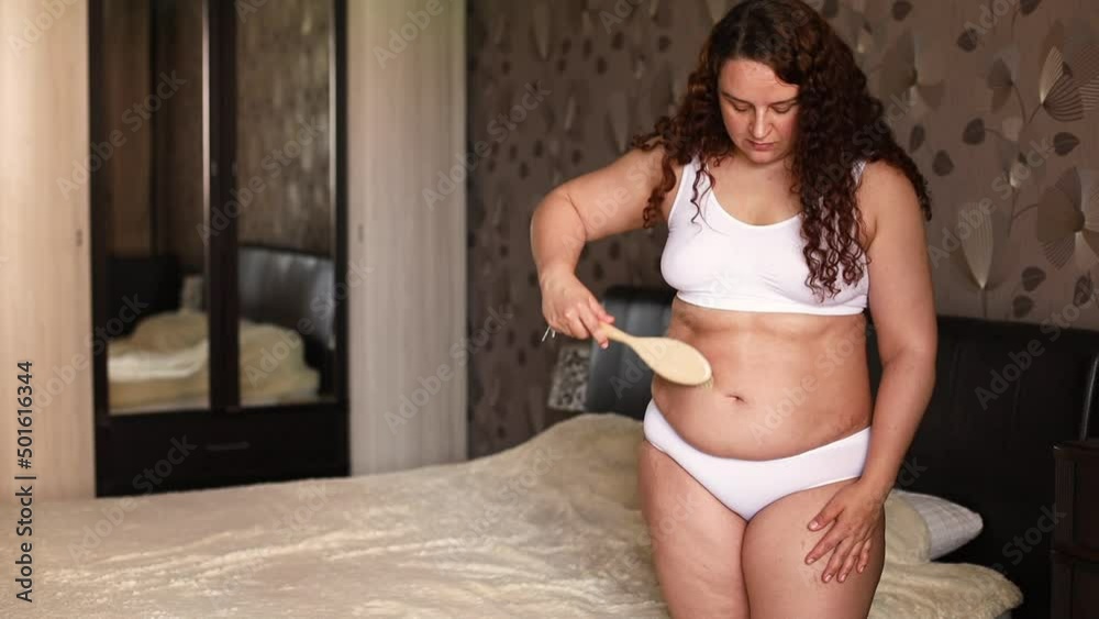 Premium Photo  Curly plus size woman in white underwear stand near bed in  bedroom and massage sagging belly with body vacuum jar fat burning  treatment of thick stomach weight loss program