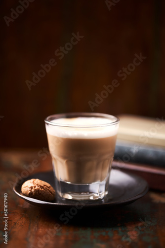 Coffee with milk on dark wooden background. Soft focus. Copy space. 