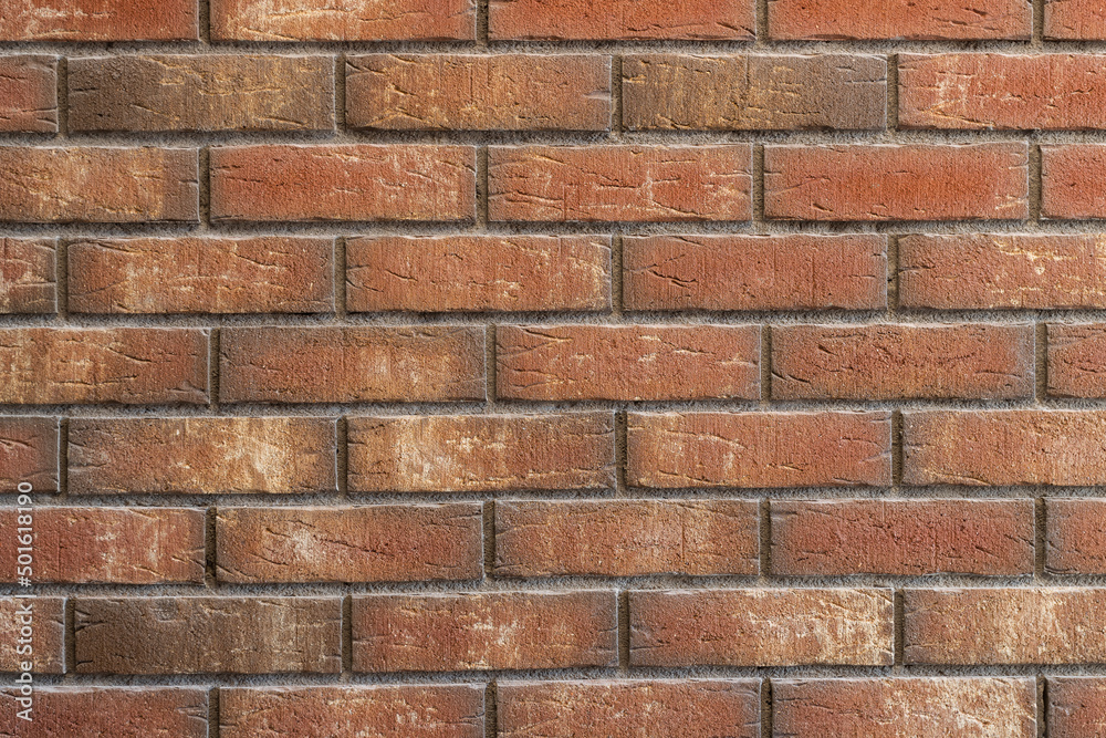 Brick wall in front view with colorful bricks
Brick wall in front view with colorful bricks