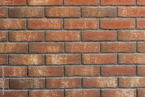 Brick wall in front view with colorful bricks 