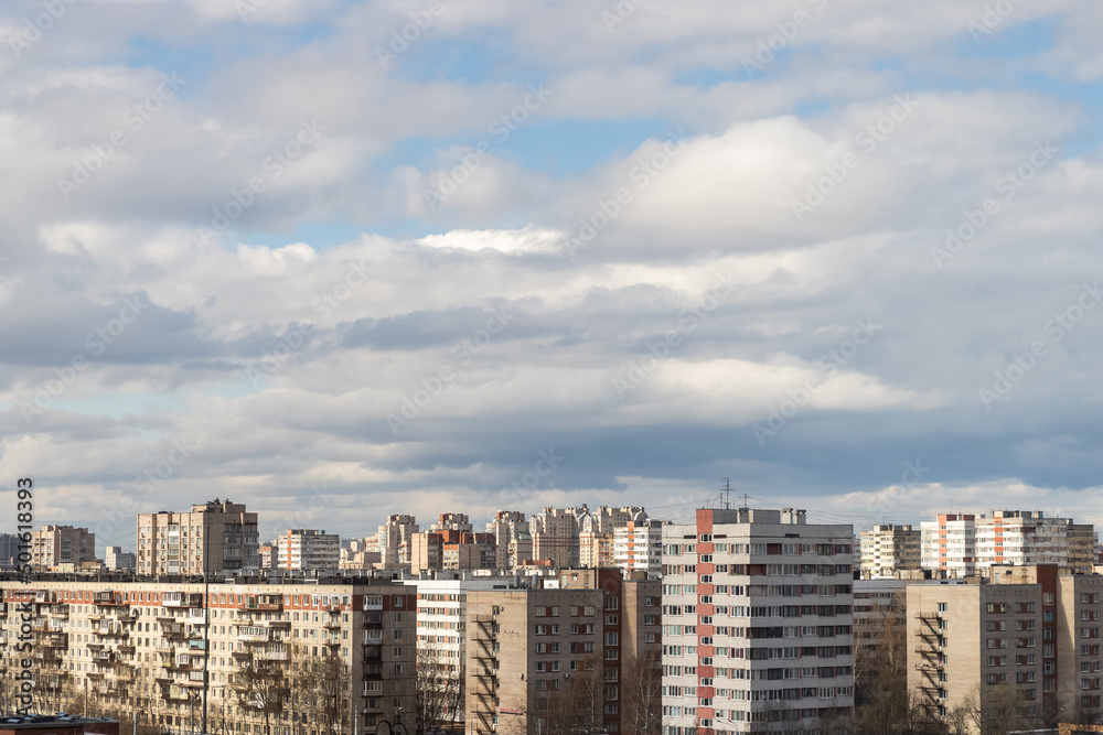 Cityscape, from the background of high-rise, buildings and blue sky with clouds in St. Petersburg
