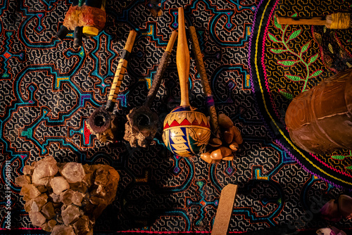 Sao Paulo, SP, Brazil - Aprilr 17 2022: Ceremony altar with shipibo fabric, florida water and Maracás Shipibo-Conibo of different models details