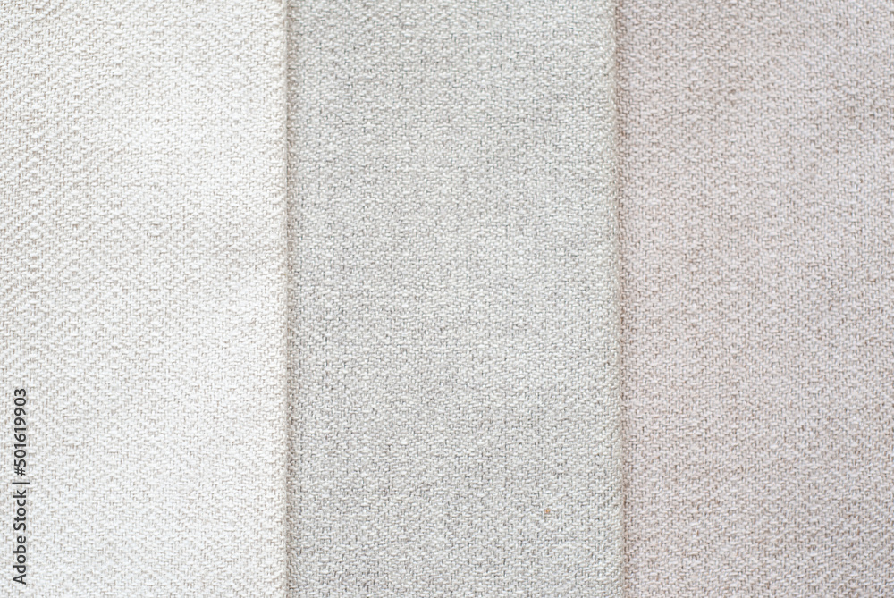Fototapeta premium Background from vertical elements. set of beige fabrics in different shades. Homogeneous texture of materials.