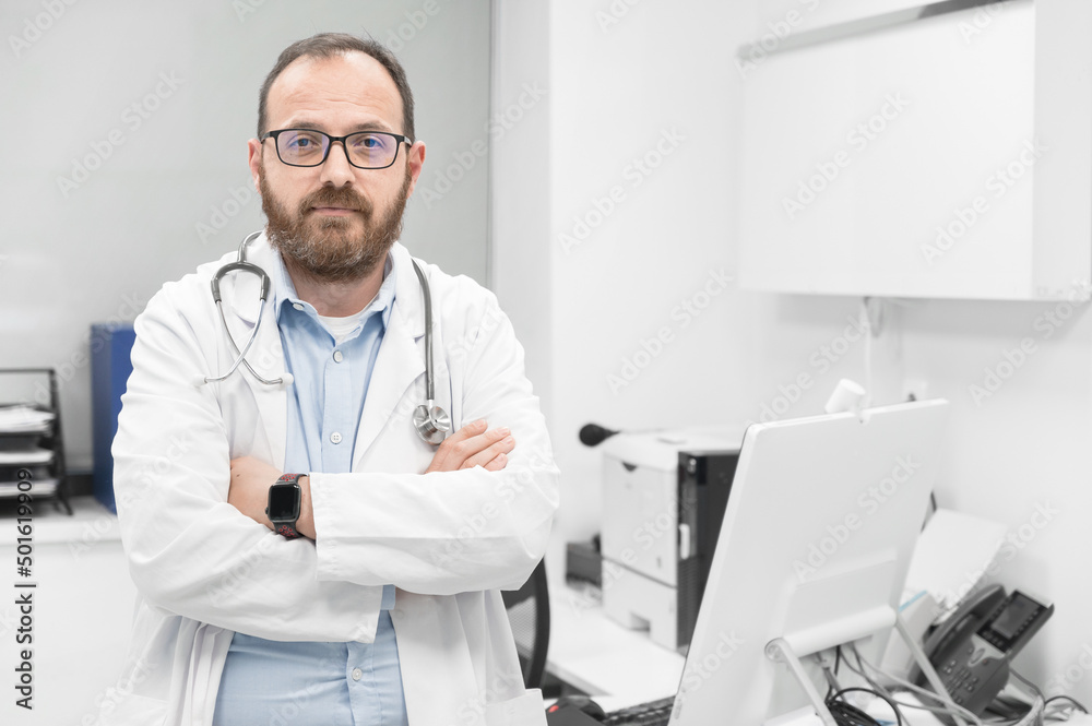 Portrait of confident doctor crossing hands and smiling at camera. High quality photography.