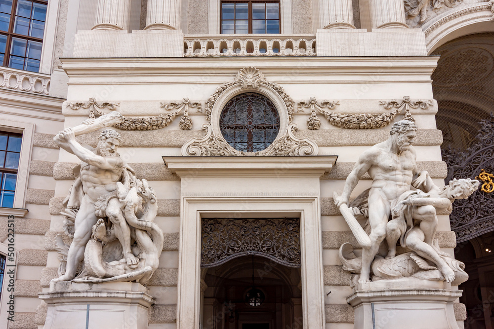 Sculptures at Hofburg palace on St. Michael square (Michaelerplatz) in Vienna, Austria
