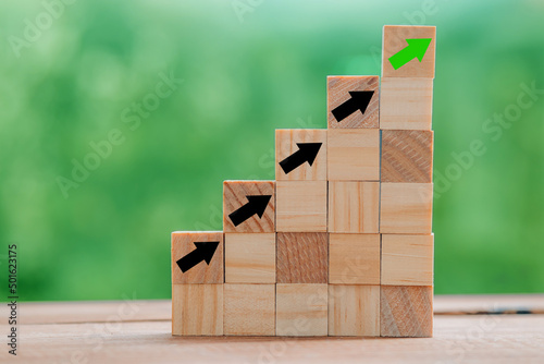 wooden pyramid structure with arrows