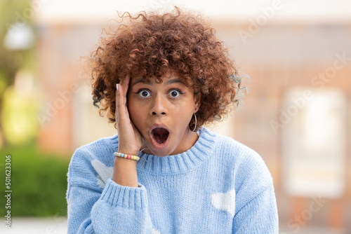 african american girl in the street with surprised expression