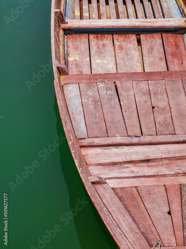 Fototapeta Detail of traditional wooden Vietnamese sampan rowboat on water