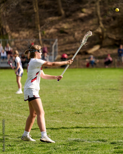 SEWICKLEY, PA, USA - APRIL13th 2022: Teenage girls from Sewickley Academy play senior school varsity lacrosse game against Freeport High School. There were lots of goals and action on this sunny day. © Karina Eremina