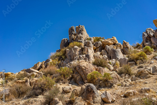 Low angel view of a hill with boulders and rocks in the Mojave Desert