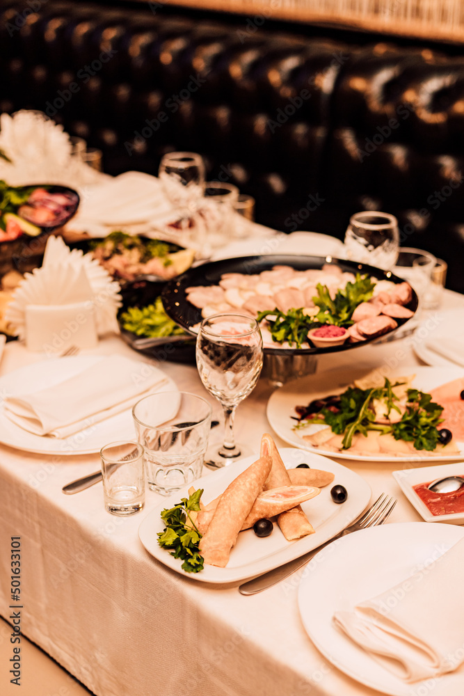 Fototapeta premium Beautifully serrated table with various dishes and snacks