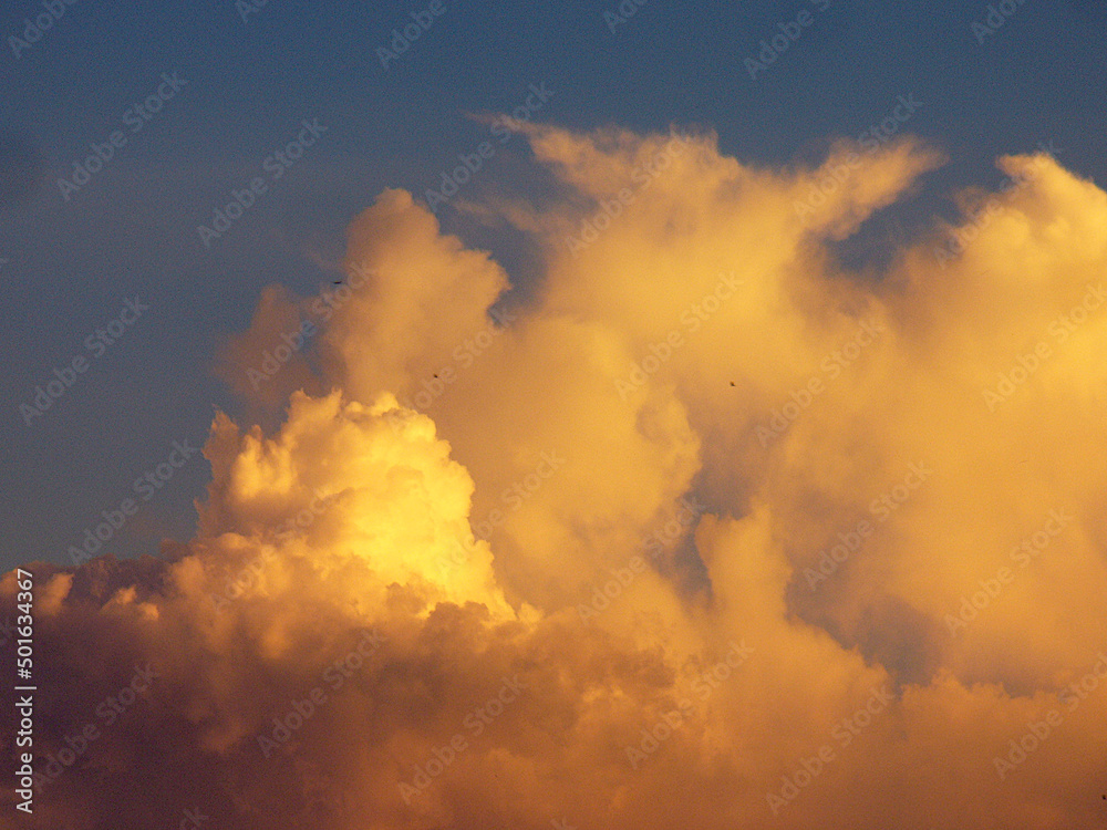 yellow clouds in the  blue sky
