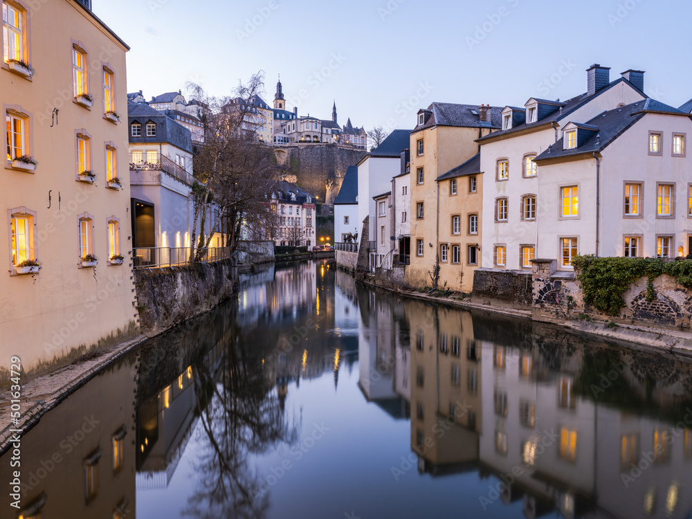Charming old town of Luxembourg on Alzette river illuminated at night