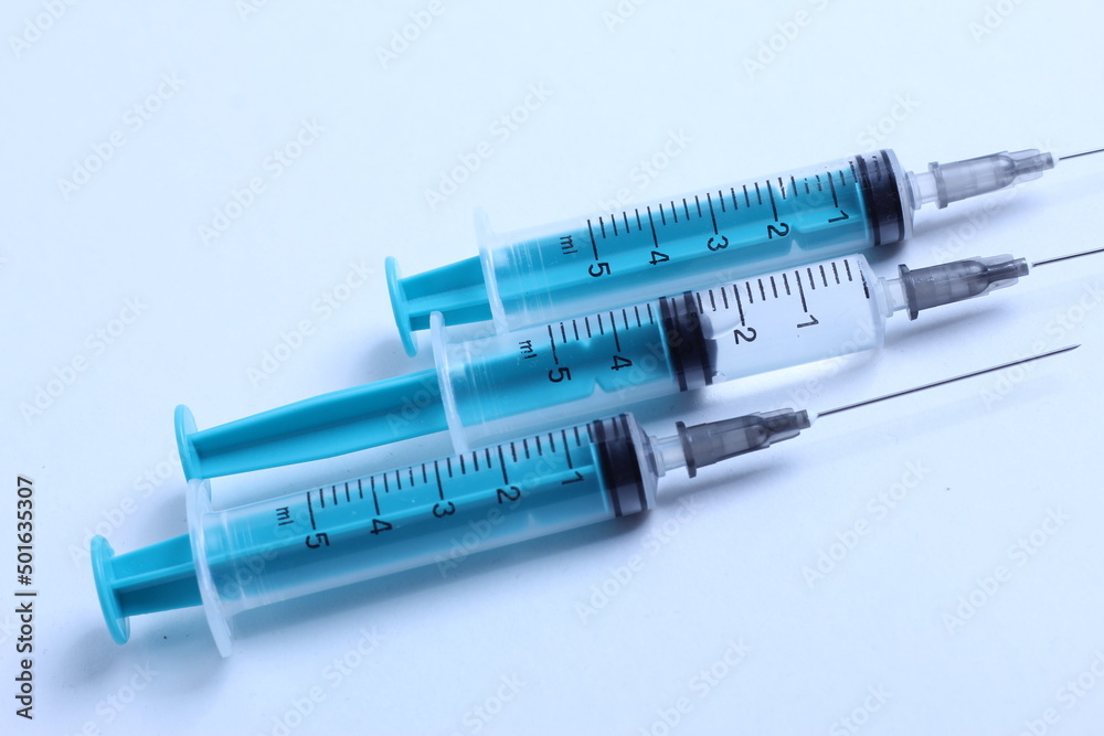 Medical syringe on a white background. A syringe for injection. The concept of health and beauty Medical syringe on a white background. A syringe for injection. The concept of health and beauty