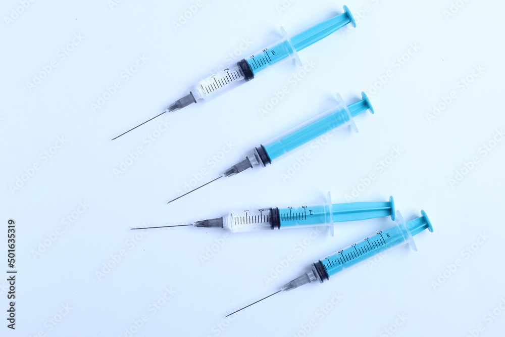 Medical syringe on a white background. A syringe for injection. The concept of health and beauty Medical syringe on a white background. A syringe for injection. The concept of health and beauty