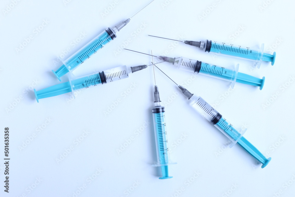 Medical syringe on a white background. A syringe for injection. The concept of health and beauty Medical syringe on a white background. A syringe for injection. The concept of health and beauty