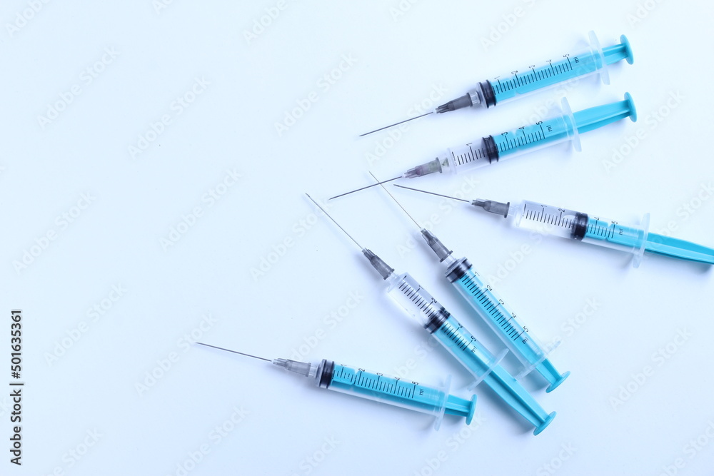 Medical syringe on a white background. A syringe for injection. The concept of health and beauty Medical syringe on a white background. A syringe for injection. The concept of health and beauty