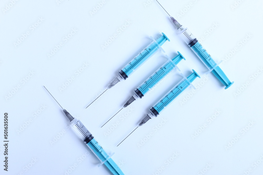 Medical syringe on a white background. A syringe for injection. The concept of health and beauty Medical syringe on a white background. A syringe for injection. The concept of health and beauty