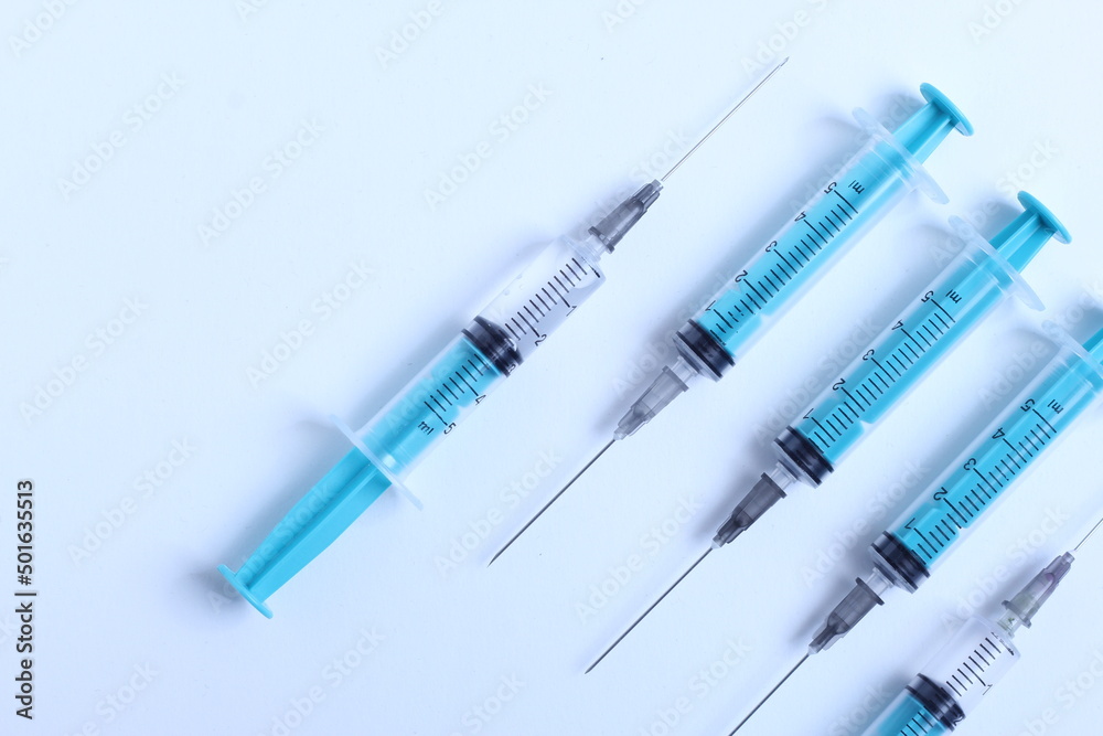 Medical syringe on a white background. A syringe for injection. The concept of health and beauty Medical syringe on a white background. A syringe for injection. The concept of health and beauty