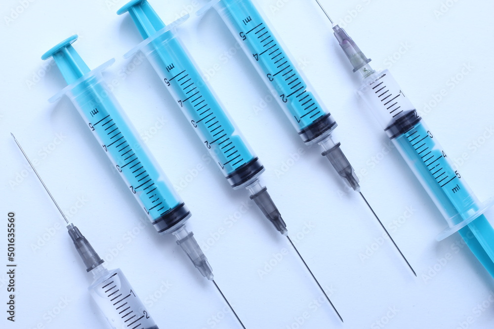 Medical syringe on a white background. A syringe for injection. The concept of health and beauty Medical syringe on a white background. A syringe for injection. The concept of health and beauty