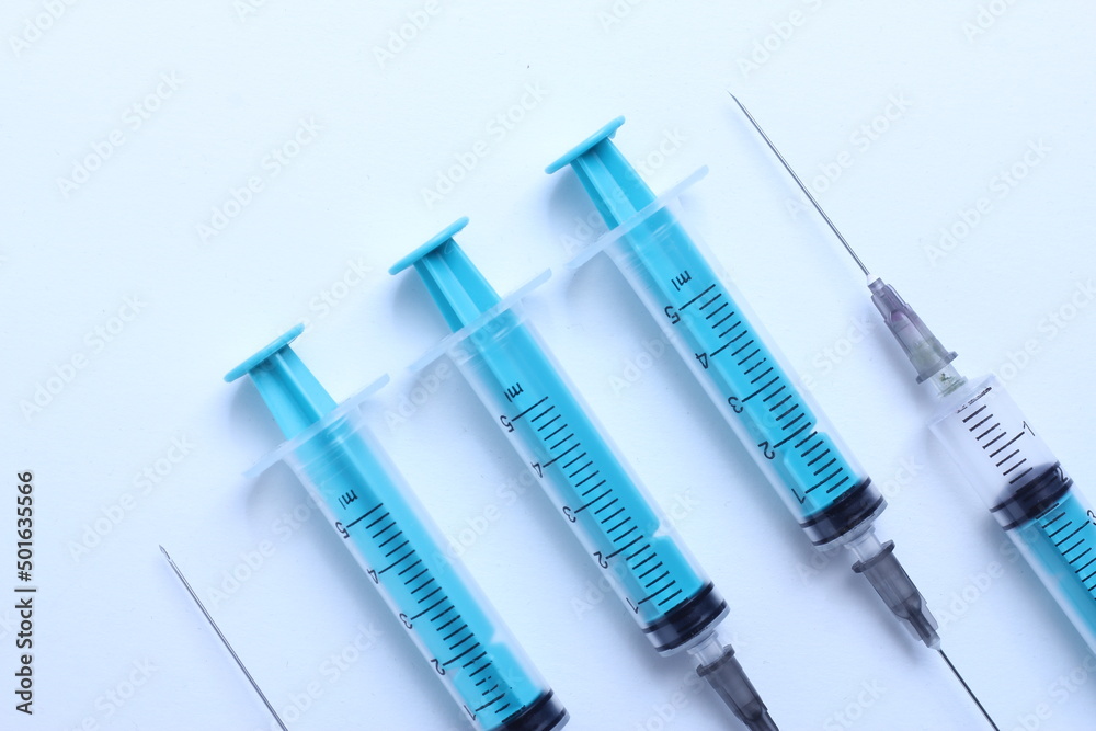 Medical syringe on a white background. A syringe for injection. The concept of health and beauty Medical syringe on a white background. A syringe for injection. The concept of health and beauty