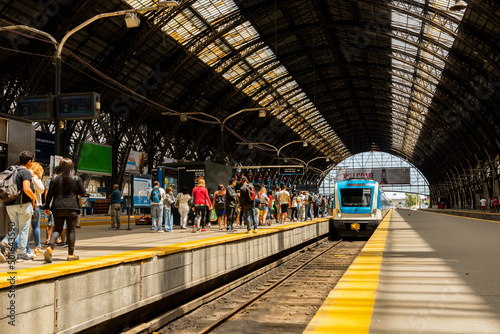 People waiting to board the train on the main platform of the Retiro station in Buenos Aires
