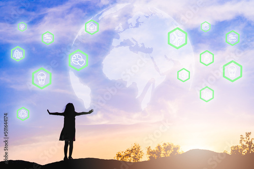 Environmental technology.Silhouette back view girl with Globe and Nature power icon technology.Sustainable development goals. SDGs.Children connection digital social ecology.Green industry.earth ocean