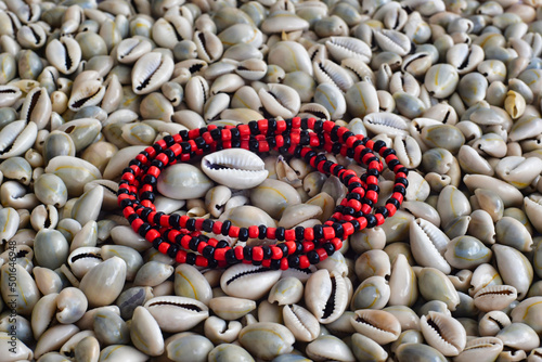 Photography image of the representative necklace of the Orisha Eleggua and snails, Yoruba re