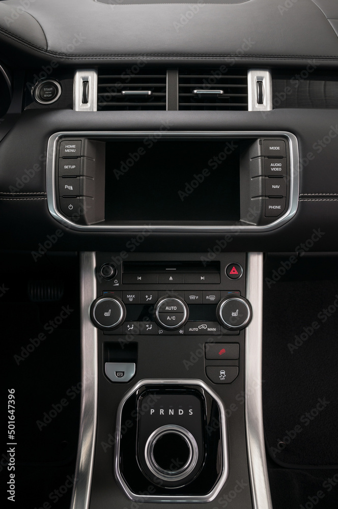 Fototapeta premium Car control panel. Interior detail. Vertical photo.