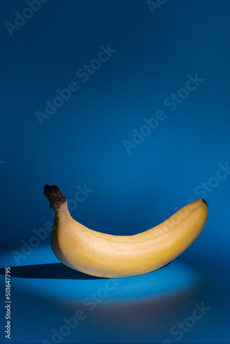 Yellow banana on a blue font