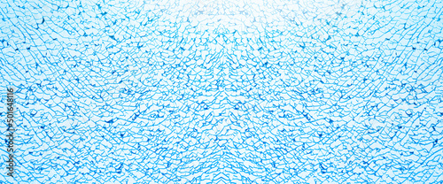 Broken glass and cracks on glass. High resolution. Texture broken glass with blue background. Panoramic cracked glass surface.