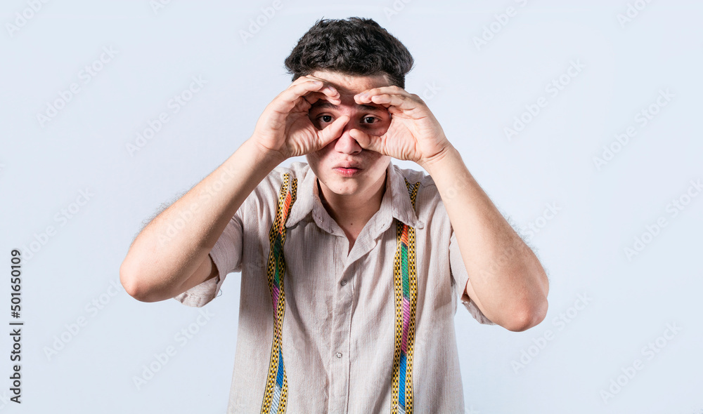 Man making binoculars gesture, Curious man making binoculars gesture, Guy on isolated background making binoculars gesture, man using his fists as binoculars Man making binoculars gesture, Curious man making binoculars gesture, Guy on isolated background making binoculars gesture, man using his fists as binoculars
