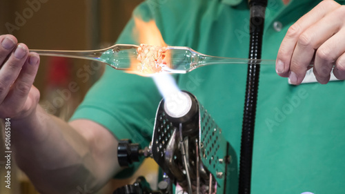 A glassblower working his craft 