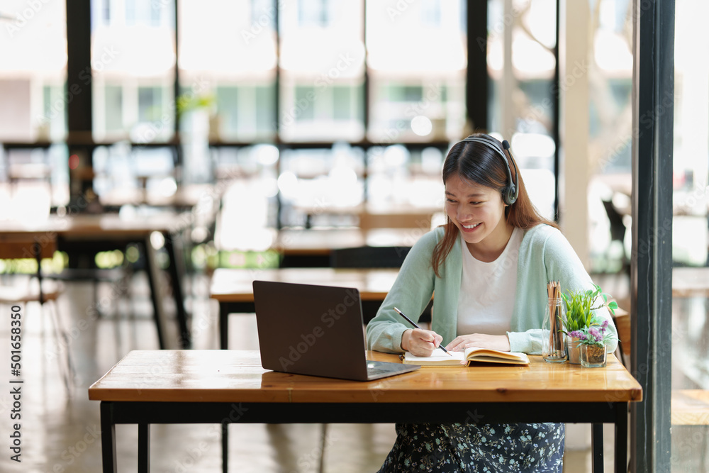 Fototapeta premium Young college student have question and answer to teacher by video call E-learning ,online ,education concept
