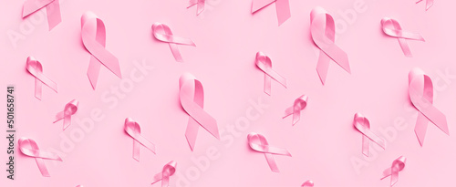 Fotografie Many pink ribbons on color background
