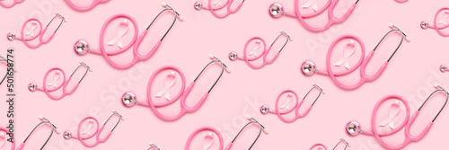 Many pink ribbons and stethoscopes on color background. Breast cancer awareness concept photo