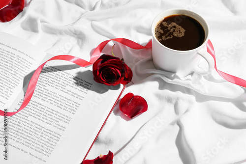 Opened book, cup of coffee ...