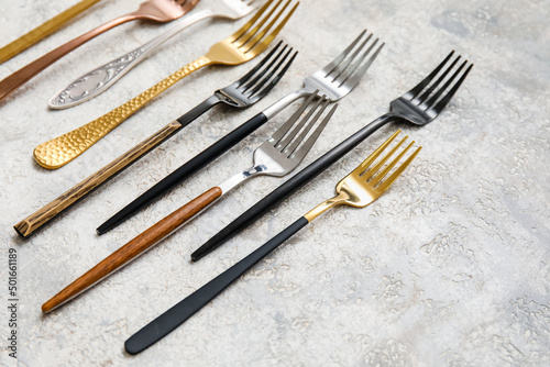 Many different forks on light background