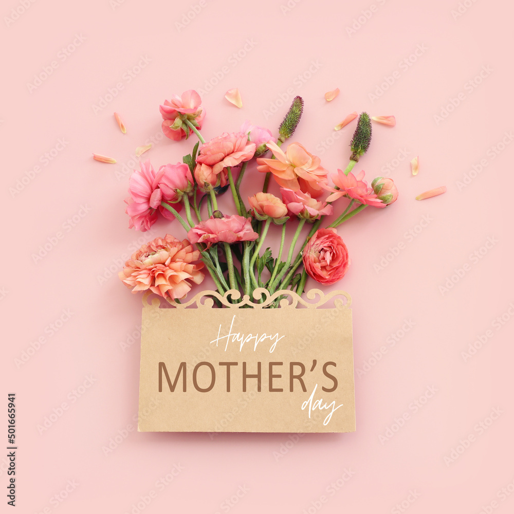 mother's day concept with pink flowers over pastel background