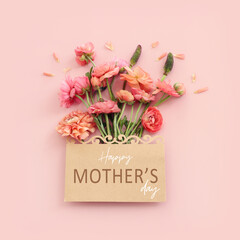 mother's day concept with pink flowers over pastel background